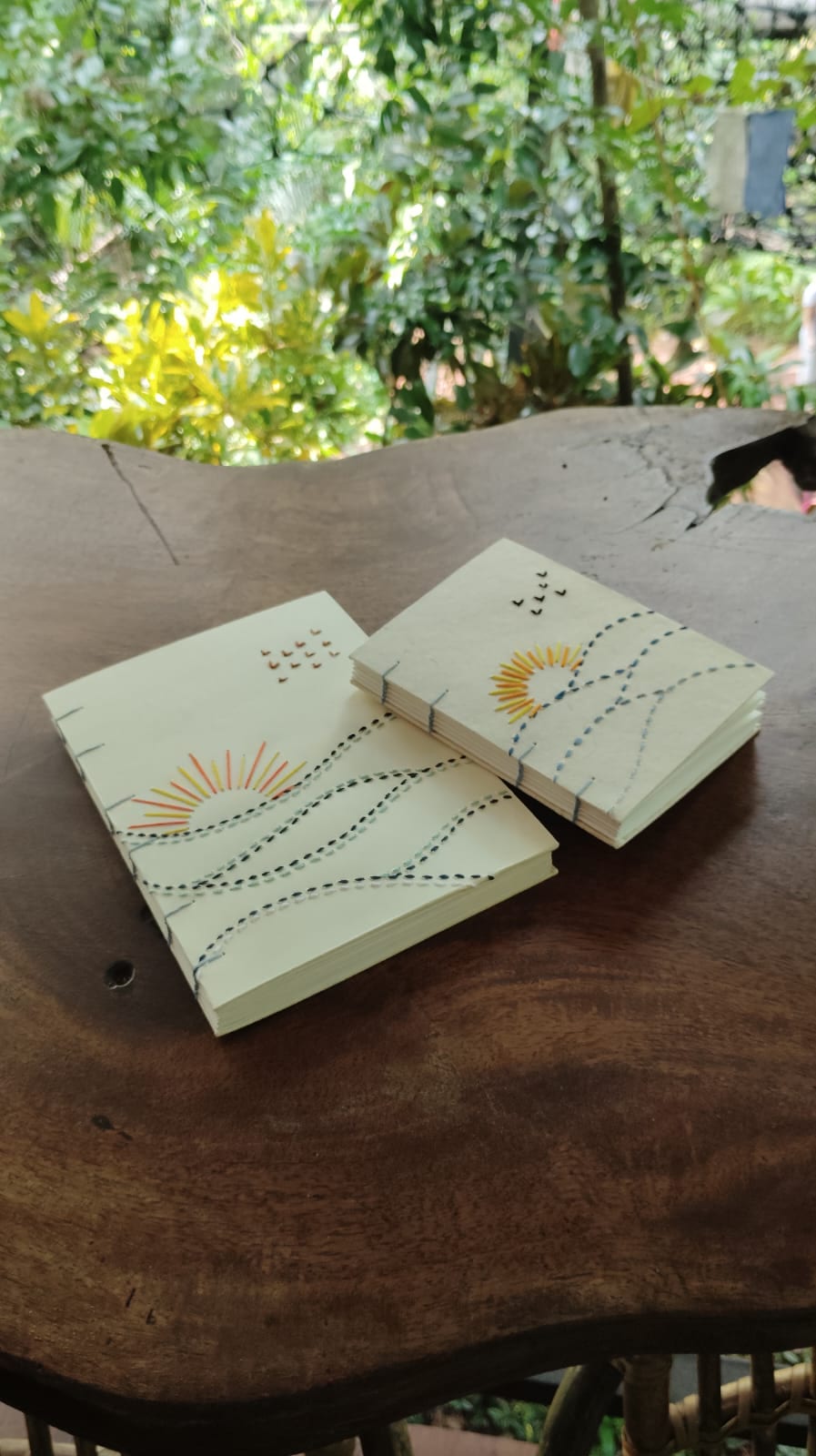 Buttonhole stitch detail on a hand-bound olive-cover journal