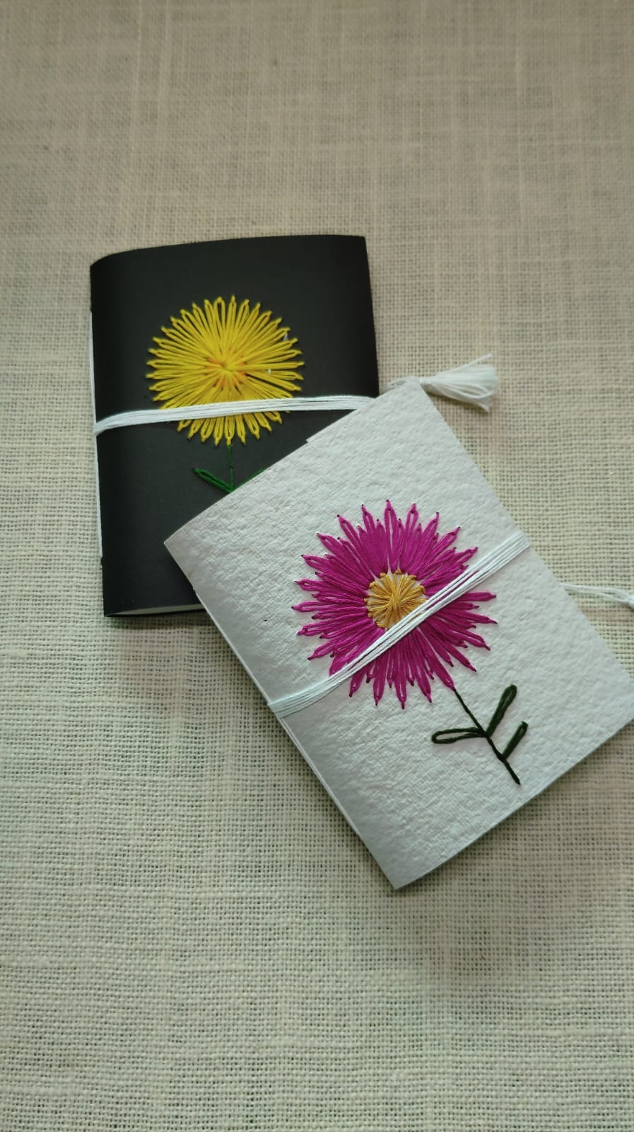 Deckle-edge cotton-rag pages on a Coptic-bound heritage guestbook