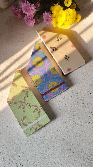 Three decorative-cover Japanese stab-bound pocket zines on handmade paper