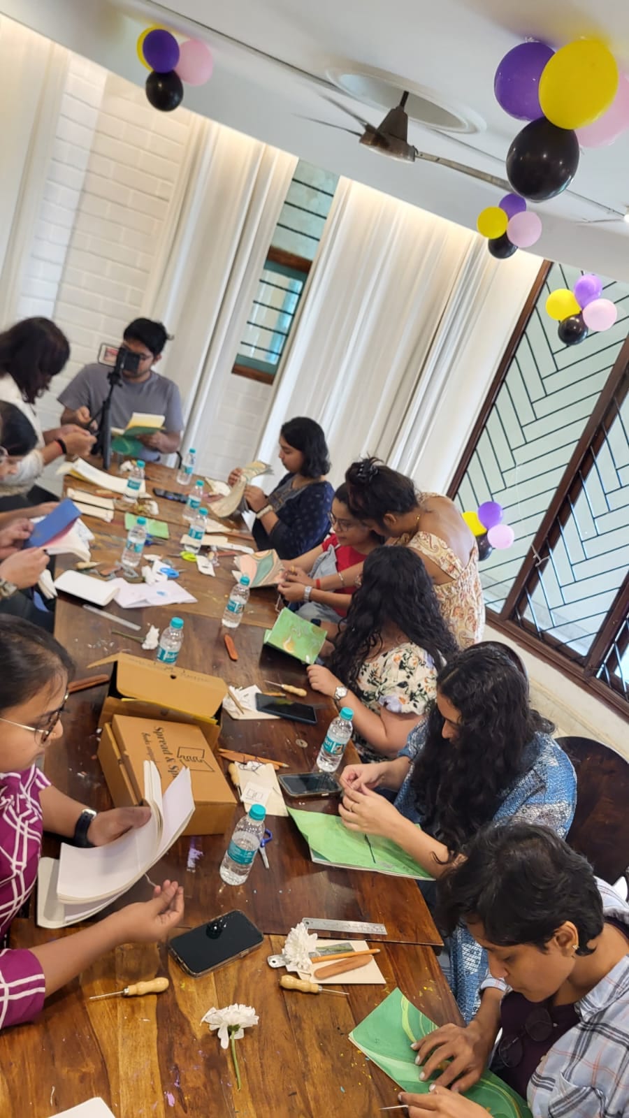 Young makers stitching their first books at a kids bookbinding workshop